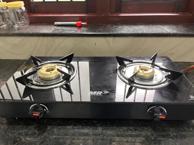 a stove with two burners on top of it at Montage Villa in Kozhikode