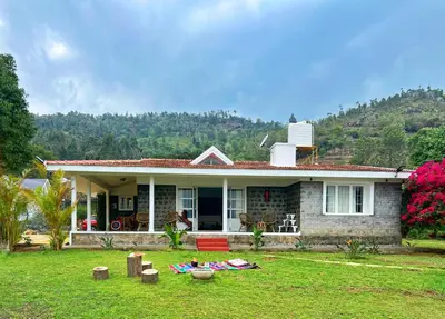 a house with a lawn in front of it at Earth songs by Green leaves - 10 kms from kotagiri in Kotagiri