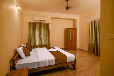 a bedroom with a bed in a room at Spectrum stays in Ambalavayal