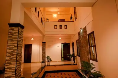 a hallway of a house with plants in it at Spectrum stays in Ambalavayal