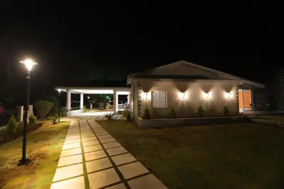 a house lit up at night with a street light at Cataleya in Kotagiri