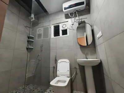 a small bathroom with a toilet and a sink at Aadvik Luxury Farmstay in Antarasante
