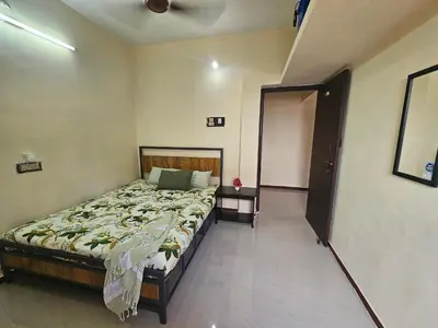 a bedroom with a bed in a room at SHI's Ganga 2BHK in GN Mills, Ganga Hospital, Women's Care Coimbatore in Coimbatore