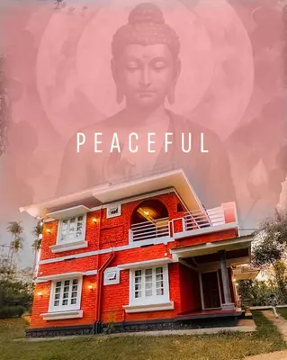 a poster of a red house with a giant head at Churuli Bungalow in Ambalavayal