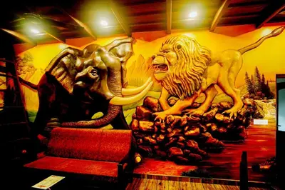 a mural of two lions on a wall at Falcon Riverview Resorts in Kuttampuzha