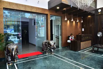 a lobby with two elephant statues in a building at SAK Royal Residency 1 km from Railway Station in Mysore