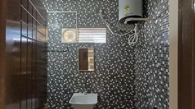 a bathroom with a sink and a toilet in it at SHI's Thulasi 2BHK in Coimbatore Near to Karpagam College, Palakkad Highway, Rathinam College and More in Coimbatore