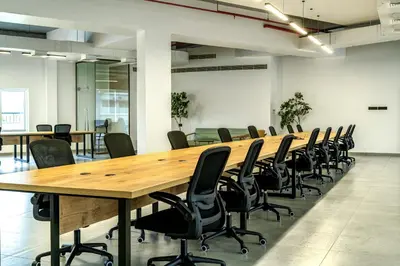 a large conference room with a long table and chairs at ESPERO INN Malappuram in Malappuram