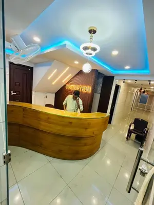 a man standing at a bar in a restaurant at Priya lodge in Kozhikode