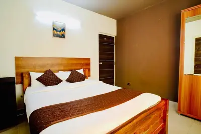 a bedroom with a large bed in a room at Elite Enclave - Tellus - 2BHK - Luxury Serviced Apartments in Mysore
