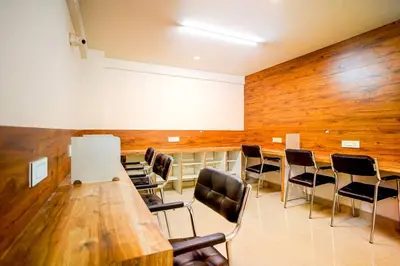 a conference room with a long table and chairs at Elite Enclave - Spark - 2BHK Luxury Serviced Apartment in Mysore
