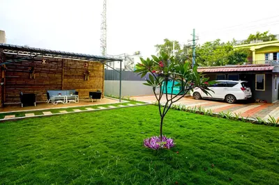 a small tree in the middle of a yard at Elite Enclave - Spark - 2BHK Luxury Serviced Apartment in Mysore