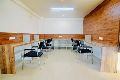 a conference room with a long table and chairs at Elite Enclave - Vento - 2BHK Luxury Serviced Apartments in Mysore