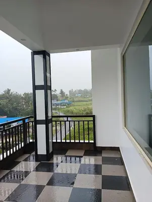 a room with a checkered floor and large windows at Bro Code Marayoor A Premium Family Friendly Retreat with Panoramic Mountain Views in Marayoor