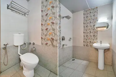 a bathroom with a toilet and a sink at Super Collection O Kushal Nagar Near KSRTC Bus Stand in Madikeri