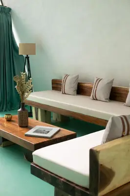a room with two beds and a table with a lamp at StayVista at Shwaas 4BR Mysore with Private pool and landscape in Mysore