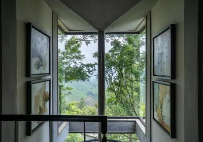 a room with a large window with a view at LohonoStays Villa Amani 8A in Coonoor