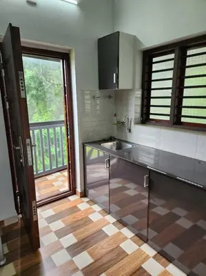 a kitchen with a sink and a counter top at Padua Building in Irrity