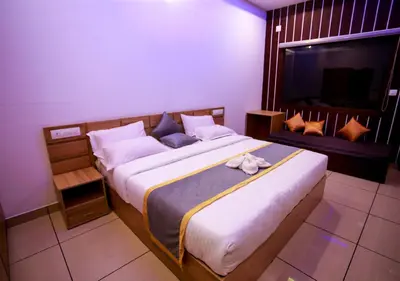 a bedroom with a large bed in a room at Wildside Wayanad in Wayanad