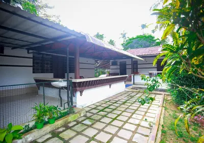 a view of a house with a patio at Wildside Wayanad in Wayanad
