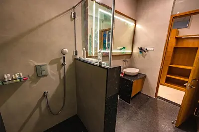 a bathroom with a shower and a sink at S R Premium Suites in Mysore