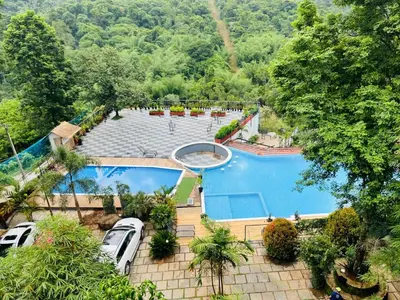 an overhead view of a swimming pool in a resort at Heaven Hills resorts in Vythiri