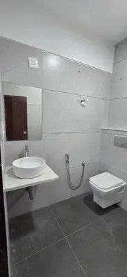 a bathroom with a sink and a toilet at GLN Residency Pure Veg in Kālvādi