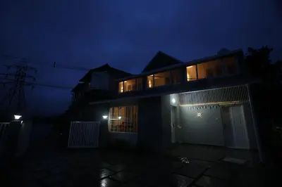 a house at night with lights on it at Haze cottage- MA Cottage in Ooty