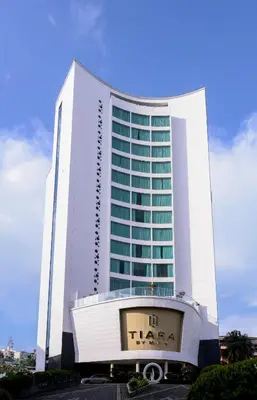 a large white building with a sign in front of it at TIARA by MPS in Kozhikode