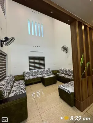 a living room with couches in a room at Diamond Villa Near Rajagiri Hospital in Alwaye