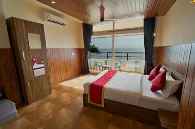 a bedroom with a bed with a view of the ocean at The Cabana in Cherai Beach