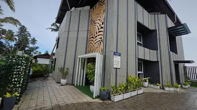 a building with plants on the side of it at The Cabana in Cherai Beach