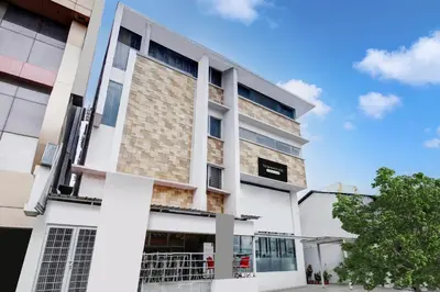 an exterior view of a building at Super Townhouse City Center Near Mysore Palace Formerly Aavass Inn in Mysore