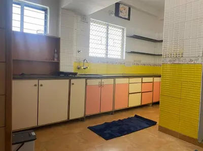 a kitchen with colorful cabinets and a sink at Royal King Bed Suite, Service Apartments, 1km to center , Free WI-FI in Mysore