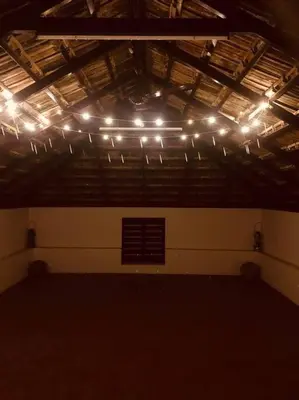 a room with a bunch of lights on the ceiling at Neermathalam, a traditional kerala tharavadu in Palakkad