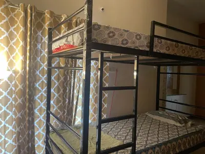 a group of bunk beds in a room at Neha's Homestay in Mysore
