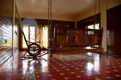 a living room with aokedoked wheel in a house at Lakshmi illam Near Isha Yoga Adiyogi in Alāndurai