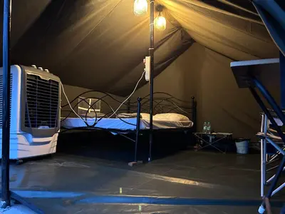 a room with a bed in a tent at Wilderness Jungle Camp in Malavalli