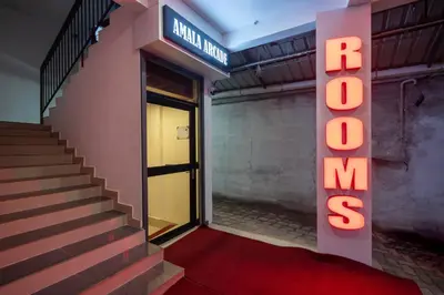 a building with a sign that reads hotel mexico at Amala Arcade AC Rooms in Trichūr