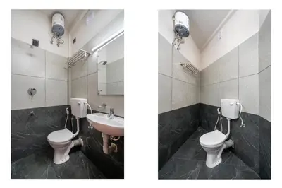 a bathroom with two toilets and a sink at Amala Arcade AC Rooms in Trichūr
