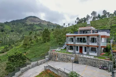 a house on the side of a hill at Abhinav Nest by Xplore Indo in Kodanād