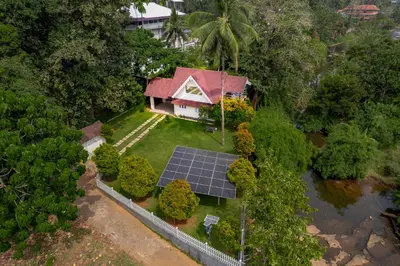 an aerial view of a house with a solar array at River Wild holiday home in Athirappilly