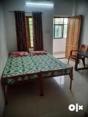 a bed in a room with a bed sidx sidx sidx at Kandengath Residency and Lodge in Mulagunnathukāvu