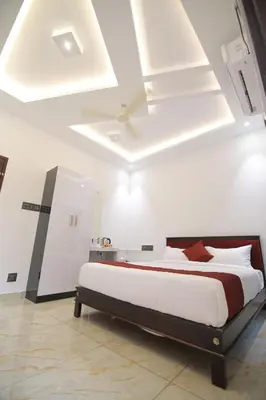 a bedroom with a large bed in a room at PitStop21 in Athirappilly
