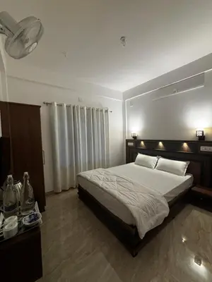 a bedroom with a large bed in a room at casa wayn homestay in Sultan Bathery