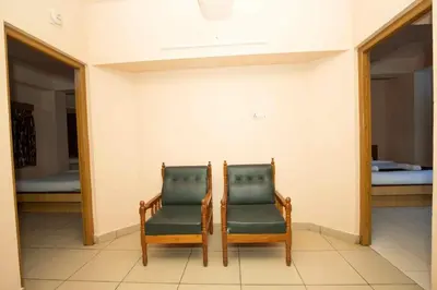 two chairs sitting next to each other in a room at Lazo Silver Lake , Ooty in Ooty
