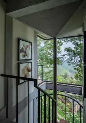 a room with a balcony with a view at LohonoStays Villa Amani 8B in Coonoor