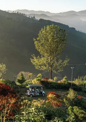 a group of people riding in a golf cart at LohonoStays Amani Villa 9A in Coonoor