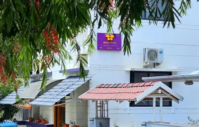 a building with a row of solar panels on it at Beedu - Backpackers Hostel in Mysore
