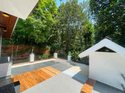a backyard with a swimming pool and a house at Tjmaryland villa in Pinangode